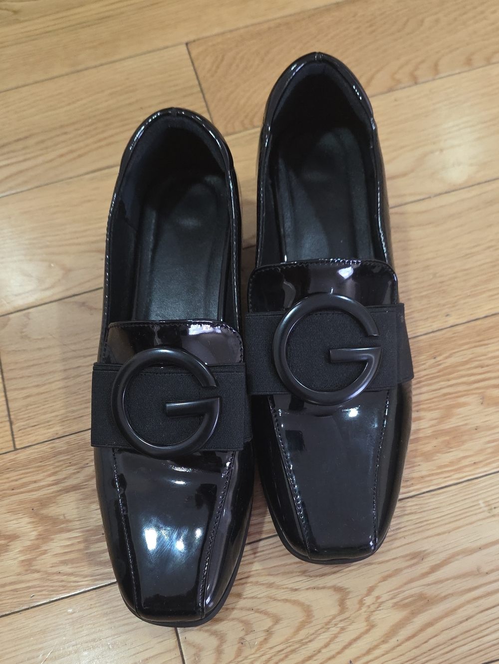 Patent Black Slip-On Loafers with Round Emblem Accent